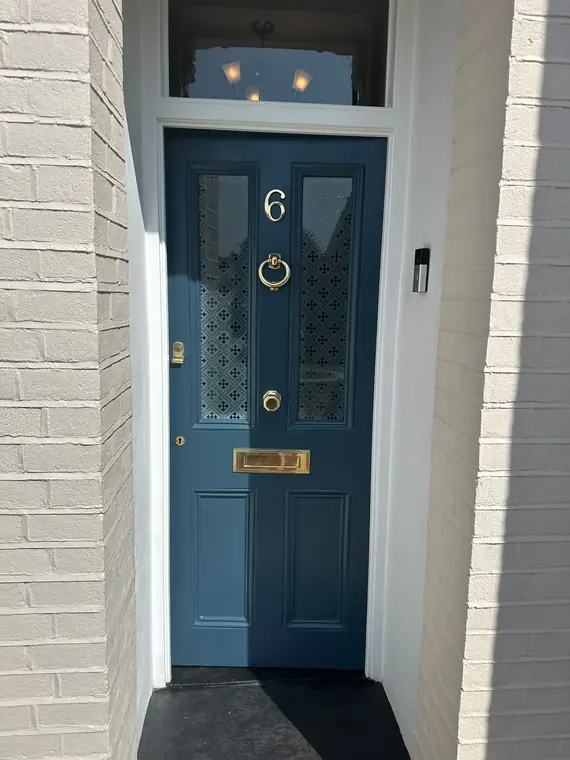 Restored blue panelled entrance door