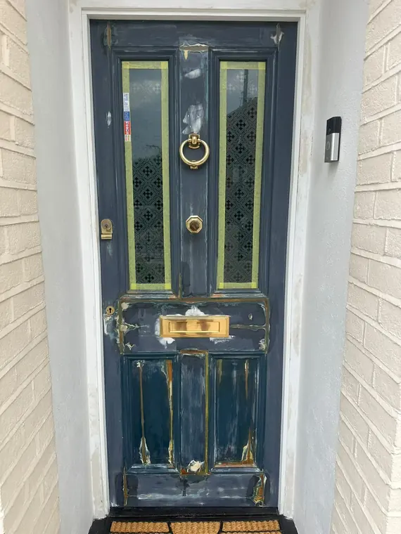 Blue timber entrance door before restoration