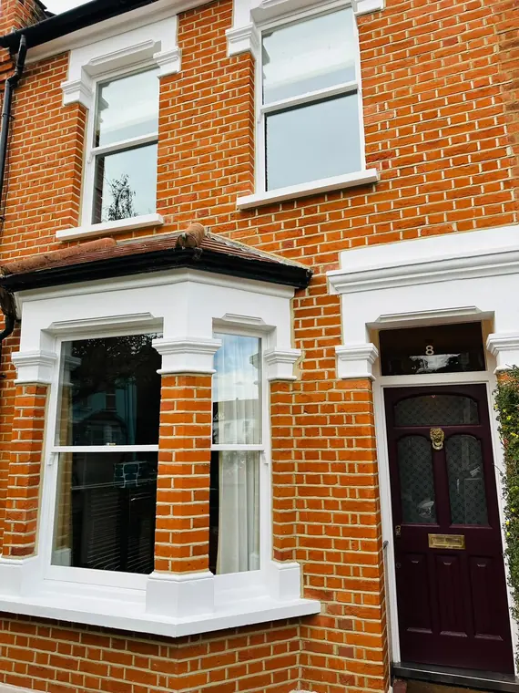 Bay joinery and burgundy entrance coordinated