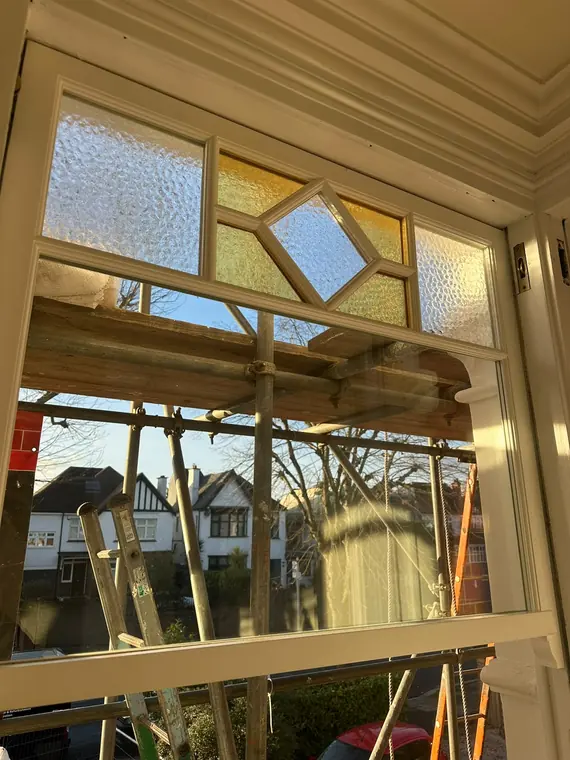 Decorative glass retained above a new sash