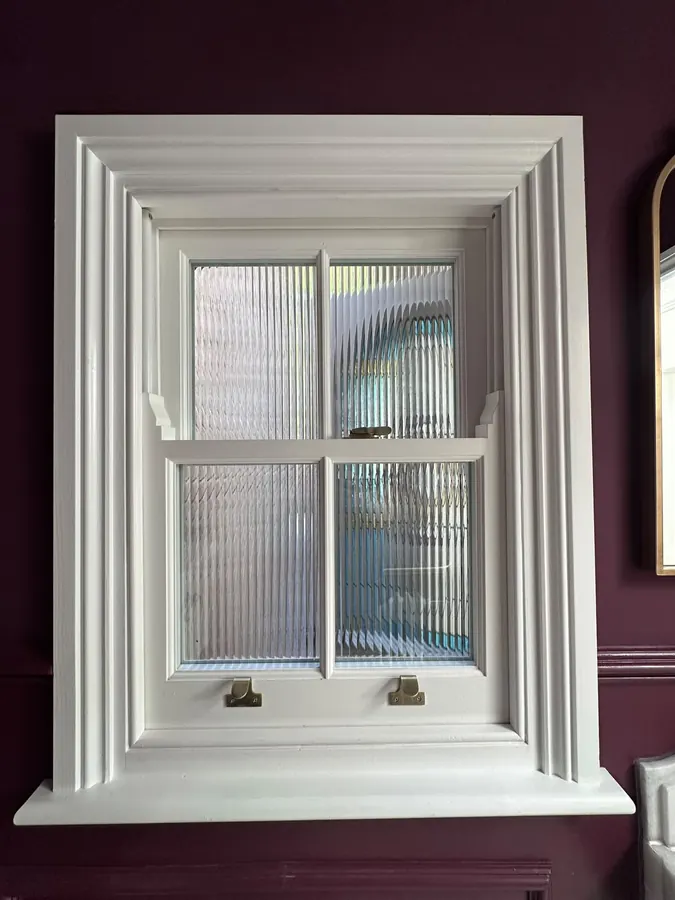 Obscured-glass sash with brass fittings