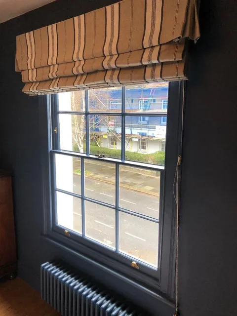 Dark-painted sash restoration